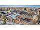 A community pool features a playground, lounge seating and lush landscaping, a perfect area for leisure at 12760 Ironstone Way # 103, Parker, CO 80134