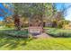 Entrance sign 'Ironstone Strroh Ranch' surrounded by lush greenery and trees, creating a welcoming atmosphere at 12760 Ironstone Way # 103, Parker, CO 80134