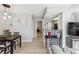 Open-concept living area with modern bar stools and easy access to kitchen at 8331 S Upham Way # 101, Littleton, CO 80128