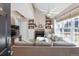 Inviting living room featuring a stone fireplace, vaulted ceilings, and abundant natural light at 8331 S Upham Way # 101, Littleton, CO 80128