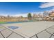 Outdoor sports court with basketball court and tennis court in a fenced area at 8331 S Upham Way # 101, Littleton, CO 80128