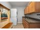 Well-equipped laundry room with washer and dryer, and storage space, and hall tree with bench at 5791 Chisholm Pl, Parker, CO 80134