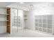 Spacious basement featuring carpet, shelving, sliding mirror doors, and recessed lighting creating an organized and functional area at 9453 W Utah Pl, Lakewood, CO 80232