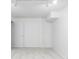 The unfinished basement with gray carpet and white walls offers endless possibilities for customization at 9453 W Utah Pl, Lakewood, CO 80232