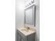Small bathroom featuring vanity with neutral countertop and faucet below decorative mirror at 9453 W Utah Pl, Lakewood, CO 80232