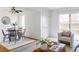 Stylish dining area featuring a round table, modern chairs, and bright, airy space, perfect for entertaining at 9453 W Utah Pl, Lakewood, CO 80232