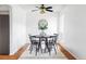 Bright dining room with a sleek table, modern decor, and hardwood floors, creating an inviting dining space at 9453 W Utah Pl, Lakewood, CO 80232