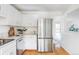 Bright, updated kitchen with stainless steel appliances, marble countertops, and ample cabinet space at 9453 W Utah Pl, Lakewood, CO 80232