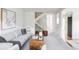Bright living room features a modern design, plush seating, and a unique wooden coffee table at 9453 W Utah Pl, Lakewood, CO 80232