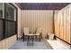 Cozy patio features two comfortable chairs and a small table, perfect for enjoying the outdoors at 9453 W Utah Pl, Lakewood, CO 80232