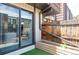 Patio features glass sliding door and raised garden bed, perfect for indoor-outdoor living at 9453 W Utah Pl, Lakewood, CO 80232