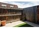Private fenced-in patio offers a tranquil outdoor space with artificial turf at 9453 W Utah Pl, Lakewood, CO 80232