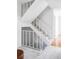 Carpeted staircase with white railing provides access to other parts of the home at 9453 W Utah Pl, Lakewood, CO 80232