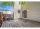 Backyard featuring a deck, wooden fence, exterior siding, and a sliding glass door at 15942 E Rice Pl # B, Aurora, CO 80015