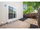 Backyard featuring a patio, exterior siding, mulch, and a sliding glass door at 15942 E Rice Pl # B, Aurora, CO 80015