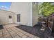 Backyard featuring a patio, exterior siding, mulch, and a wooden fence at 15942 E Rice Pl # B, Aurora, CO 80015