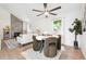 Modern dining space adjacent to living room, featuring modern decor and abundant light at 15942 E Rice Pl # B, Aurora, CO 80015