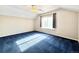 Spacious bedroom with vaulted ceilings, a ceiling fan, and a large window at 2247 Coronado Pkwy N #D, Denver, CO 80229