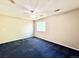 Spacious bedroom is well-lit with a ceiling fan, neutral walls, and a large window for natural light at 2247 Coronado Pkwy N #D, Denver, CO 80229