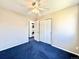 View of bedroom with a laundry room featuring a stackable washer and dryer at 2247 Coronado Pkwy N #D, Denver, CO 80229