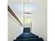 Staircase leading down with a large window providing natural light at 2247 Coronado Pkwy N #D, Denver, CO 80229
