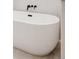Modern freestanding bathtub with elegant fixtures and clean lines at 4139 Benton Street, Denver, CO 80212
