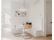 Bright breakfast nook with banquette seating, modern chairs, and stylish lighting at 4139 Benton Street, Denver, CO 80212