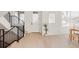 Entryway showcasing modern staircase, natural light, and light wood flooring at 4139 Benton Street, Denver, CO 80212