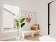 Inviting entryway with bench seating, coat hooks, and natural light at 4139 Benton Street, Denver, CO 80212