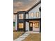 Charming home exterior showcasing modern design, black accents, and manicured landscaping at 4139 Benton Street, Denver, CO 80212