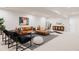 Expansive living room with leather sectional, modern furnishings, and contemporary artwork at 4139 Benton Street, Denver, CO 80212