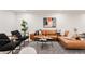 Stylish living room showcasing a leather sofa, modern seating, and contemporary decor at 4139 Benton Street, Denver, CO 80212