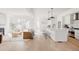 Open concept living room with light wood floors, and modern furnishings at 4139 Benton Street, Denver, CO 80212