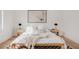 Cozy main bedroom with natural light, neutral bedding, and stylish nightstands at 4139 Benton Street, Denver, CO 80212