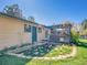 Inviting backyard with a custom stone patio, fire pit, lush lawn, and a pergola-covered deck at 13133 Regulus Dr, Lone Tree, CO 80124