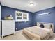 Bedroom with a bright window, dresser, and bed at 13133 Regulus Dr, Lone Tree, CO 80124