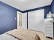 Bedroom with a view into the ensuite, and closet space at 13133 Regulus Dr, Lone Tree, CO 80124