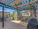 Outdoor deck with a blue pergola, grill, and comfortable seating at 13133 Regulus Dr, Lone Tree, CO 80124