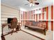 Finished basement game room with ceiling fan, futon, and desk, perfect for entertaining at 13133 Regulus Dr, Lone Tree, CO 80124