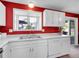 Bright kitchen features ample white countertop and cabinetry with a view from the sink at 13133 Regulus Dr, Lone Tree, CO 80124