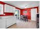 Bright kitchen and dining area with white appliances and a sliding door to the deck at 13133 Regulus Dr, Lone Tree, CO 80124