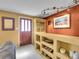 Living room with built-in shelving and display cabinet, featuring an interesting decor at 13133 Regulus Dr, Lone Tree, CO 80124