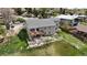 Aerial view of the home's rear exterior with a deck and landscaped yard at 6839 Estes Dr, Arvada, CO 80004