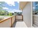 Cozy balcony with wood railing, offering a relaxing outdoor space with neighborhood views at 3298 Quail St, Wheat Ridge, CO 80033