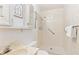 A bright bathroom with a shower and classic vanity at 3298 Quail St, Wheat Ridge, CO 80033