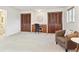 Bedroom featuring an arm chair, built in desk, closet and neutral carpet at 3298 Quail St, Wheat Ridge, CO 80033