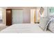 A bedroom with access to the bathroom and a large closet for storage at 3298 Quail St, Wheat Ridge, CO 80033