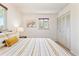 A bedroom with a large closet and natural light at 3298 Quail St, Wheat Ridge, CO 80033