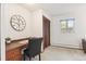 Bedroom featuring a built in desk, neutral carpet and closet at 3298 Quail St, Wheat Ridge, CO 80033