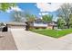 Charming exterior of a two-story home with a long driveway and well-manicured lawn at 3298 Quail St, Wheat Ridge, CO 80033